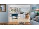 Open kitchen with stylish blue accents, breakfast bar, and an abundance of natural light at 3510 Deer Run Rd, Seabrook Island, SC 29455