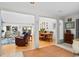 Open-concept living room and dining area with hardwood floors, neutral decor, and lots of natural light at 3510 Deer Run Rd, Seabrook Island, SC 29455
