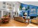 Spacious living room with high ceilings, a fireplace, a balcony and nautical decor at 3510 Deer Run Rd, Seabrook Island, SC 29455