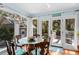 Sunny sun room with picturesque windows, ideal for enjoying meals and connecting with nature at 3510 Deer Run Rd, Seabrook Island, SC 29455