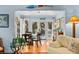 Bright sun room with glass table and charming chairs, connecting to the main living space at 3510 Deer Run Rd, Seabrook Island, SC 29455