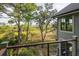 Relaxing balcony view overlooking lush marshlands and wooded area, perfect for enjoying nature at 37 Marsh Edge, Kiawah Island, SC 29455