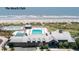 A stunning beach club view featuring multiple pools, a bar, lounge chairs, and beautiful beach access at 37 Marsh Edge, Kiawah Island, SC 29455