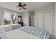 Bedroom with beds, dresser, closet, and lovely views from large windows at 37 Marsh Edge, Kiawah Island, SC 29455