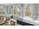 Bright bedroom featuring sofa and two twin sized beds and two large windows at 37 Marsh Edge, Kiawah Island, SC 29455