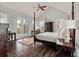 Bedroom featuring wood floors, ceiling fan, and an access door to the outside patio at 37 Marsh Edge, Kiawah Island, SC 29455