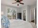 Relaxing bedroom boasts stunning view of the outside with a ceiling fan and dresser at 37 Marsh Edge, Kiawah Island, SC 29455