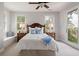 Bright bedroom with hardwood accents, a ceiling fan and a window seat bench at 37 Marsh Edge, Kiawah Island, SC 29455