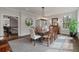 Elegant dining room with a dark wood table, seating for ten, and bright natural light at 37 Marsh Edge, Kiawah Island, SC 29455