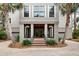 Charming front entrance with brick steps, columns, and lush greenery at 37 Marsh Edge, Kiawah Island, SC 29455