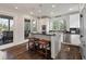 Modern kitchen with stainless appliances, granite countertops, and island with breakfast bar at 37 Marsh Edge, Kiawah Island, SC 29455