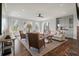 Bright and airy living room with comfortable seating, built-ins, and a view of the outdoors at 37 Marsh Edge, Kiawah Island, SC 29455