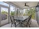 Inviting screened porch with dining area, perfect for enjoying outdoor meals at 37 Marsh Edge, Kiawah Island, SC 29455