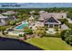 Aerial shot of the Sports Pavilion with a pool, jacuzzi, and manicured gardens overlooking the water at 37 Marsh Edge, Kiawah Island, SC 29455