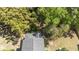 Aerial view displays the rooftop of a home surrounded by mature trees, emphasizing privacy at 3717 Tip Ln, Mount Pleasant, SC 29466