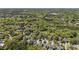 Aerial view of a residential area surrounded by a dense forest canopy at 3717 Tip Ln, Mount Pleasant, SC 29466