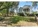 Backyard with lawn and a view of the screened porch at 3717 Tip Ln, Mount Pleasant, SC 29466