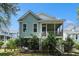 Exterior of home with a porch overlooking a lush backyard, perfect for outdoor living at 3717 Tip Ln, Mount Pleasant, SC 29466