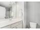 Clean bathroom featuring a white vanity, mirror, and a shower with glass doors at 3717 Tip Ln, Mount Pleasant, SC 29466