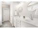 Bright bathroom featuring a dual sink vanity with chrome fixtures and a glass shower at 3717 Tip Ln, Mount Pleasant, SC 29466