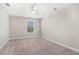 Bright bedroom with a ceiling fan, window, neutral walls, and carpeted flooring at 3717 Tip Ln, Mount Pleasant, SC 29466