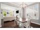 Dining area with pendant lighting and a view of the living room and fireplace, creating an inviting atmosphere at 3717 Tip Ln, Mount Pleasant, SC 29466