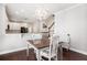 Cozy dining area featuring a modern chandelier, with views of the kitchen and staircase at 3717 Tip Ln, Mount Pleasant, SC 29466