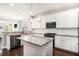 Bright kitchen features white cabinets, granite countertops, stainless appliances, and a kitchen island at 3717 Tip Ln, Mount Pleasant, SC 29466