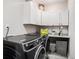 Convenient laundry room with modern appliances, white cabinetry, and granite countertop, perfect for everyday tasks at 3717 Tip Ln, Mount Pleasant, SC 29466