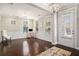 Bright living room features hardwood floors, a decorative rug, and traditional trim at 3717 Tip Ln, Mount Pleasant, SC 29466