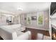 Bright living room features hardwood floors, a fireplace, and traditional trim at 3717 Tip Ln, Mount Pleasant, SC 29466