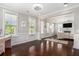 Bright living room features hardwood floors, a decorative rug, and traditional trim at 3717 Tip Ln, Mount Pleasant, SC 29466
