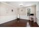Bright living room features hardwood floors, a decorative rug, and traditional trim at 3717 Tip Ln, Mount Pleasant, SC 29466