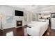 Cozy living room features hardwood floors, a fireplace, and an adjoining room with an open concept design at 3717 Tip Ln, Mount Pleasant, SC 29466
