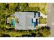 Aerial view of the property showcasing the pool, outdoor seating area, and well-maintained landscaping at 409 W Indian Ave, Folly Beach, SC 29439