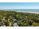 Stunning aerial view of a home near the beach, with lush greenery and ocean views at 409 W Indian Ave, Folly Beach, SC 29439