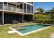Backyard with a swimming pool, lounge area, and a covered patio space at 409 W Indian Ave, Folly Beach, SC 29439
