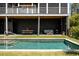 Beautiful backyard featuring a swimming pool, patio, and comfortable seating area at 409 W Indian Ave, Folly Beach, SC 29439