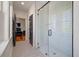 Bathroom with a glass-enclosed shower, black fixtures, and patterned tile floors at 409 W Indian Ave, Folly Beach, SC 29439