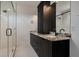 Bathroom showcases dual vanities, granite counters, and a glass-enclosed shower at 409 W Indian Ave, Folly Beach, SC 29439
