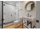 Modern bathroom with tiled shower, updated sink, and stylish fixtures at 409 W Indian Ave, Folly Beach, SC 29439