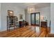Spacious dining room with hardwood floors, elegant lighting, and vintage furnishings creating a sophisticated atmosphere at 409 W Indian Ave, Folly Beach, SC 29439