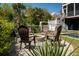 Inviting backyard with a stone fire pit and seating, perfect for outdoor gatherings and relaxation at 409 W Indian Ave, Folly Beach, SC 29439