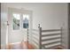 Hallway with natural light and staircase at 409 W Indian Ave, Folly Beach, SC 29439