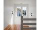 Upstairs hallway with wood floors and plenty of natural light at 409 W Indian Ave, Folly Beach, SC 29439