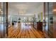Open-concept living area with hardwood floors and an abundance of natural light at 409 W Indian Ave, Folly Beach, SC 29439