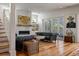 Cozy living room features hardwood floors, fireplace, and stylish decor at 409 W Indian Ave, Folly Beach, SC 29439