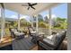 Relaxing screened-in porch with comfortable seating and tranquil views at 409 W Indian Ave, Folly Beach, SC 29439