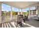 Relax on the porch with rocking chairs and enjoy a scenic view of the neighborhood at 409 W Indian Ave, Folly Beach, SC 29439