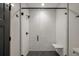 Contemporary bathroom boasts a glass-enclosed shower with a built-in bench at 409 W Indian Ave, Folly Beach, SC 29439